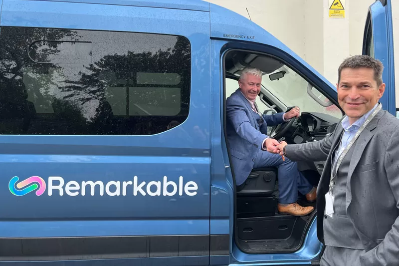 Robin Bush (right) at donation of new electric van. 