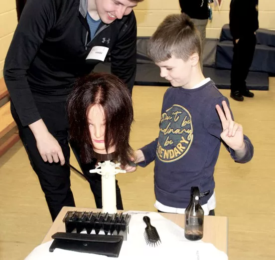 Student cutting hair